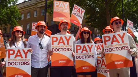 Why did resident doctors strike and what are they paid?
